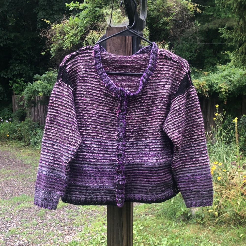 Handknitted sparkly purple, pink, gray, and black cardigan